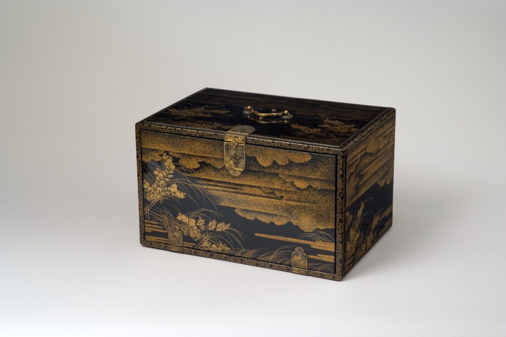 Book cabinet with lacquered wood, gold and silver inlay