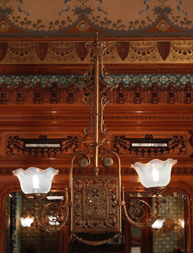Wall bracket in brass, mother-of-pearl, glass shades and semi-precious stones