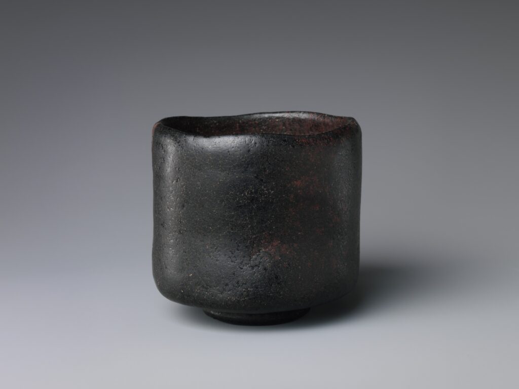 Chawan: a Black Raku tea bowl, hand-molded earthenware with an opaque black glaze, early 17th century