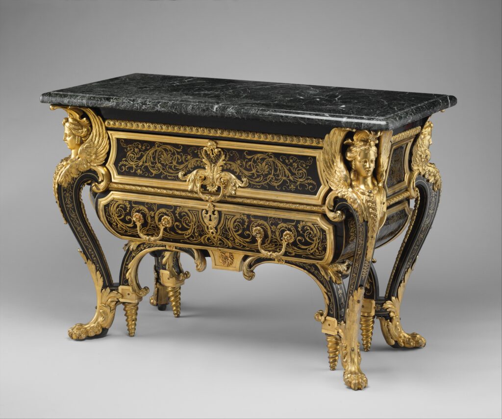 Antique French commode with a low black body inlaid with brass and tortoiseshell, carved gilt-bronze figures at the corners, spiral and scrolled gilt feet and a dark green marble top