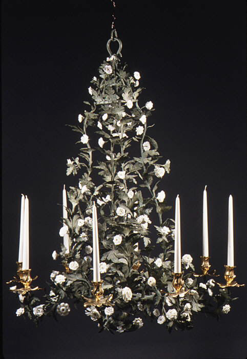 Chandelier shaped like a small tree, with green painted iron leaves, white porcelain flowers and white candles on gilt-bronze holders