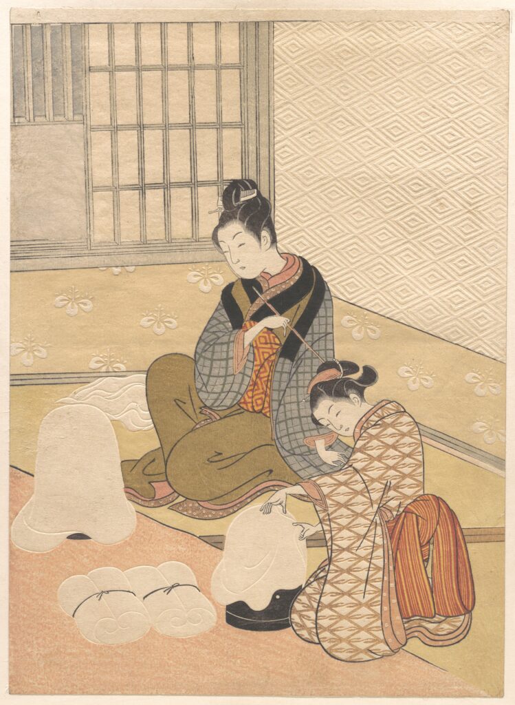 japanese interior design Colour woodblock print of two women seated on a mat-covered floor beside a window of wooden bars and a sliding paper panel, with white floss silk draped over round lacquered heaters