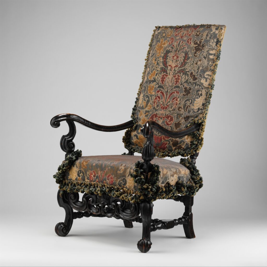 Baroque armchair from the Burley-on-the-Hill suite, ca. 1689, with a tall raked back and scrolled arms and legs