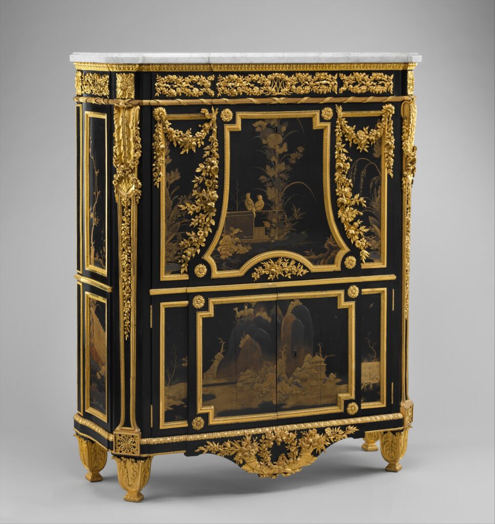 Tall black lacquer cabinet with a marble top, gilt-bronze swags and garlands of flowers, and a central panel of Japanese lacquer